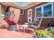 Charming outdoor patio with comfortable seating and a lovely view of a fenced yard at 821 Mark St, Belmont, NC 28012