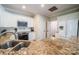 Bright kitchen featuring granite countertops, stainless steel appliances, and ample cabinet space at 8271 Camelia Ln, Denver, NC 28037