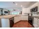 Bright kitchen featuring granite countertops, stainless steel appliances, and hardwood floors at 8271 Camelia Ln, Denver, NC 28037