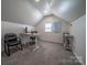 Bright office space with neutral carpet, modern desk, and a window view at 8271 Camelia Ln, Denver, NC 28037