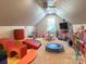 Spacious playroom with soft carpet, trampoline, and many toys/play structures at 8271 Camelia Ln, Denver, NC 28037