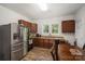 This eat in kitchen features stainless steel appliances and lots of natural light at 833 Old Charlotte Sw Rd, Concord, NC 28027