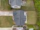 Aerial view of the home, showcasing the roof, landscaping, and surrounding neighborhood at 8453 Mossy Cup Trl, Harrisburg, NC 28075