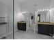 Primary bath featuring granite countertop and dual vanities at 8453 Mossy Cup Trl, Harrisburg, NC 28075
