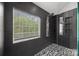 Shower with tiled walls, mosaic floors, window and modern fixtures at 8453 Mossy Cup Trl, Harrisburg, NC 28075