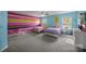 Playful bedroom with colorful walls, two beds and natural light at 8453 Mossy Cup Trl, Harrisburg, NC 28075