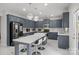 Modern kitchen with pendant lights, stainless steel appliances, and white countertops at 8453 Mossy Cup Trl, Harrisburg, NC 28075