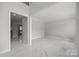 Bright living room with marble floors and neutral walls at 8453 Mossy Cup Trl, Harrisburg, NC 28075