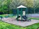 Outdoor playground with a slide and climbing structure in a neighborhood park at 8453 Mossy Cup Trl, Harrisburg, NC 28075