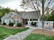 Community pool area with a fenced pool, lounge chairs, and a pool house at 8453 Mossy Cup Trl, Harrisburg, NC 28075