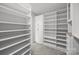 Walk-in closet featuring custom shelving and ample storage at 8453 Mossy Cup Trl, Harrisburg, NC 28075
