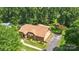 Aerial view of a well-maintained home, surrounded by lush greenery and a spacious backyard at 8835 Glencroft Rd, Mint Hill, NC 28227