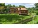 Expansive backyard with a screened porch, mature trees, and a well-maintained lawn at 8835 Glencroft Rd, Mint Hill, NC 28227