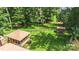Expansive backyard with lush green lawn, wooden fence, shed, and screened porch for outdoor living at 8835 Glencroft Rd, Mint Hill, NC 28227