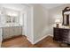Well-lit bathroom with vanity, wood floors, and ample storage space providing a functional and stylish design at 8835 Glencroft Rd, Mint Hill, NC 28227