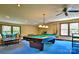 Spacious game room featuring a pool table, comfortable seating, and ample natural light at 8835 Glencroft Rd, Mint Hill, NC 28227