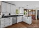 Bright kitchen featuring white cabinets, granite countertops, and stainless steel appliances at 8835 Glencroft Rd, Mint Hill, NC 28227