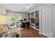 Bright office featuring custom built-ins, modern desk, and natural light from the large window at 8835 Glencroft Rd, Mint Hill, NC 28227