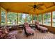 Inviting screened-in porch with comfortable seating and views of the landscaped yard at 8835 Glencroft Rd, Mint Hill, NC 28227
