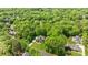 Aerial view of the property surrounded by mature trees, lush lawns, and neighborhood streets at 914 Elizabeth Ln, Matthews, NC 28105