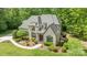 Aerial view of the home showing mature trees, landscaping, and the architectural features of the roof at 914 Elizabeth Ln, Matthews, NC 28105