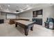 Finished basement features a pool table, kitchenette, and an entertainment area with a projector at 914 Elizabeth Ln, Matthews, NC 28105