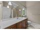 Bathroom with vanity, tile floor, and granite counters at 914 Elizabeth Ln, Matthews, NC 28105