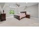 Bedroom featuring a vaulted ceiling, large window, and natural light at 914 Elizabeth Ln, Matthews, NC 28105
