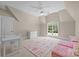 Bedroom with large window, desk, and pink couch at 914 Elizabeth Ln, Matthews, NC 28105