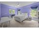 Bedroom with white furniture, neutral carpet, and windows with curtains at 914 Elizabeth Ln, Matthews, NC 28105