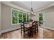 Dining area featuring a large window with scenic views and stylish lighting at 914 Elizabeth Ln, Matthews, NC 28105