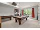 Spacious game room featuring a billiard table, wet bar, and projector for entertainment at 914 Elizabeth Ln, Matthews, NC 28105