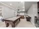 Basement recreation area featuring a pool table, shuffleboard table, and projector at 914 Elizabeth Ln, Matthews, NC 28105