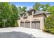 The large three-car garage offers ample parking and storage space, complemented by the home's exterior at 914 Elizabeth Ln, Matthews, NC 28105