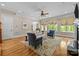 Comfortable living room has natural light, hardwood floors, and elegant decor at 914 Elizabeth Ln, Matthews, NC 28105