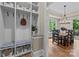 Mudroom featuring custom shelving, hooks, and seating with backyard views at 914 Elizabeth Ln, Matthews, NC 28105