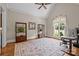 Office with a large window, hardwood floors, vaulted ceilings, and decorative area rug at 914 Elizabeth Ln, Matthews, NC 28105