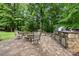 An outdoor kitchen boasts a built-in grill and stone accents, creating a perfect entertainment space at 914 Elizabeth Ln, Matthews, NC 28105