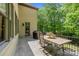 Outdoor patio with a grill, dining table and lush greenery at 914 Elizabeth Ln, Matthews, NC 28105
