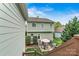 Backyard featuring a patio with seating, lush lawn, and well-maintained landscaping at 10210 Roosevelt Dr, Huntersville, NC 28078