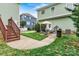 Landscaped backyard featuring a patio, grill, and green lawn perfect for outdoor enjoyment at 10210 Roosevelt Dr, Huntersville, NC 28078