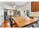 Dining area next to kitchen features wood floors and modern lighting at 10210 Roosevelt Dr, Huntersville, NC 28078