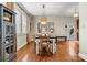 Dining room with wood flooring, modern decor, and natural light at 10210 Roosevelt Dr, Huntersville, NC 28078