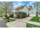 Lovely home featuring a detached garage and a well-manicured lawn at 10210 Roosevelt Dr, Huntersville, NC 28078
