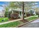 Attractive home with a classic design, complemented by mature trees and lush shrubs at 10210 Roosevelt Dr, Huntersville, NC 28078