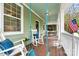 Cozy front porch with rocking chairs and porch swings at 10210 Roosevelt Dr, Huntersville, NC 28078