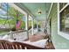 Relaxing front porch with comfortable swing seating at 10210 Roosevelt Dr, Huntersville, NC 28078