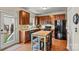 A kitchen with cherry cabinets, stainless steel appliances, and a breakfast table at 10210 Roosevelt Dr, Huntersville, NC 28078