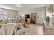 Comfortable room with TV, bed, couch, and shelf at 10210 Roosevelt Dr, Huntersville, NC 28078