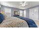 This bedroom features carpet, gray walls, and many windows at 10210 Roosevelt Dr, Huntersville, NC 28078